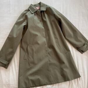 Peachy den green trench coat with button-up front and pockets
